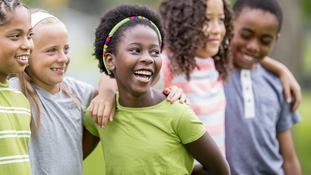Group of kids getting ready to play a game outside