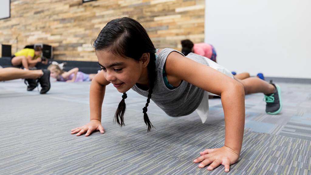girl doing exercises in gym