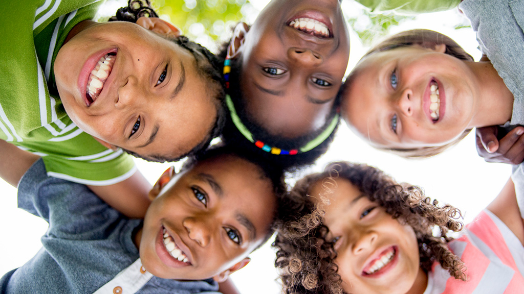Smiling kids showing an "I will" mood