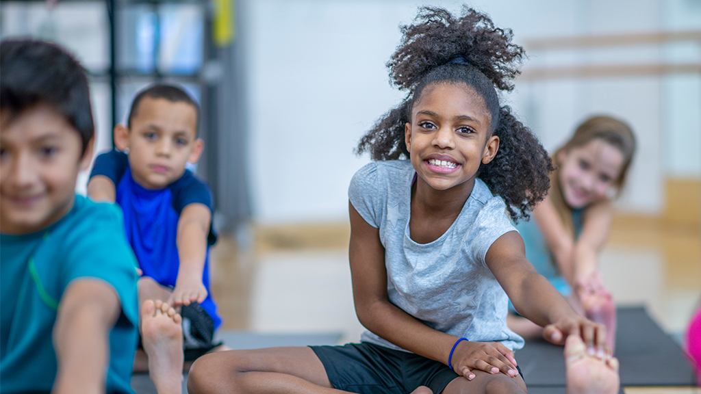 Kids doing stretching exercises to relax
